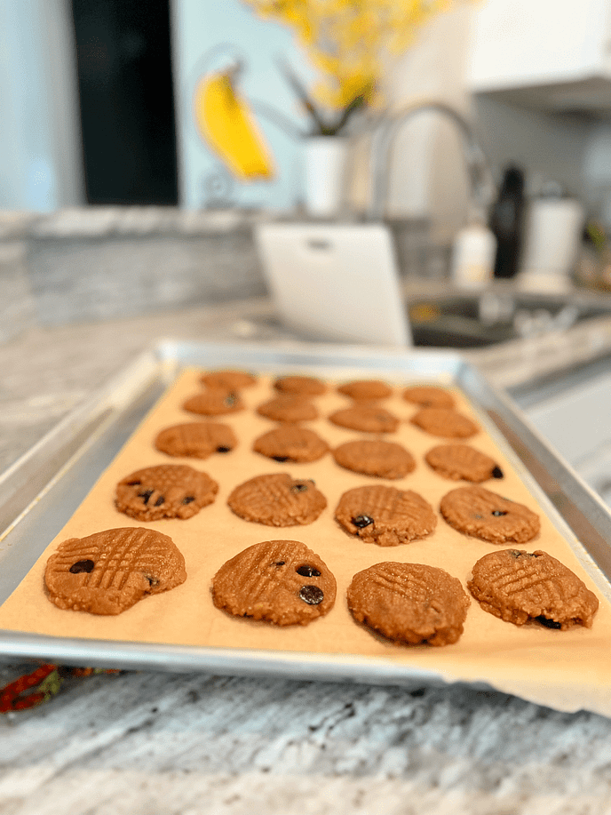 Adding fork marks to peanut butter chocolate chip cookies